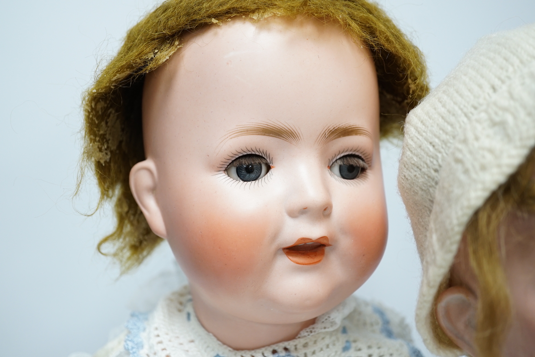 A Schoenau Hoffmeister 160 Special bisque head bent limb composition body, 60cm, good condition, and a Mengers Gereuth Porzellanfabrik doll, 53cm